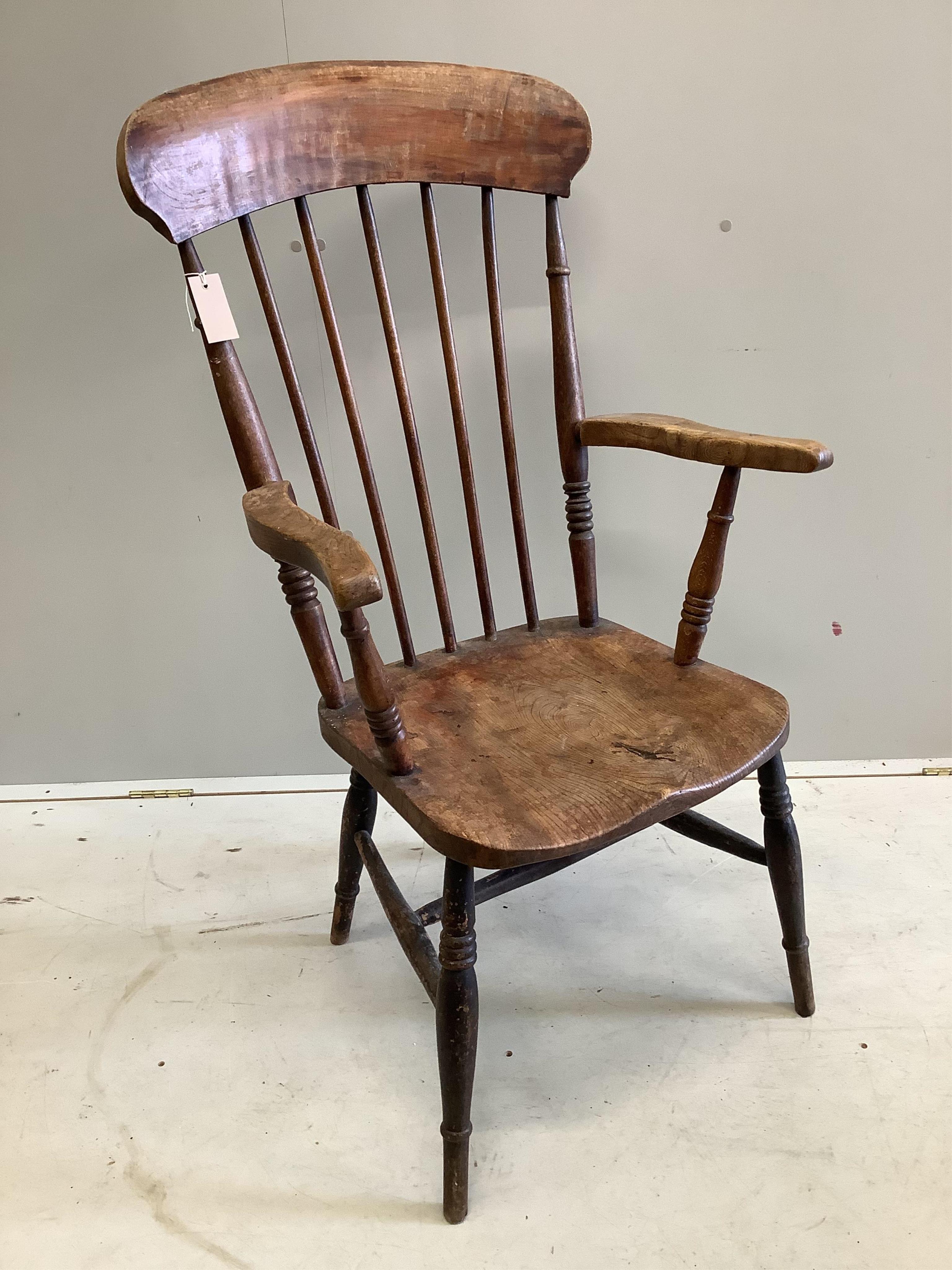 A late Victorian ash, elm and beech spindle back Windsor chair, height 113cm. Condition - fair